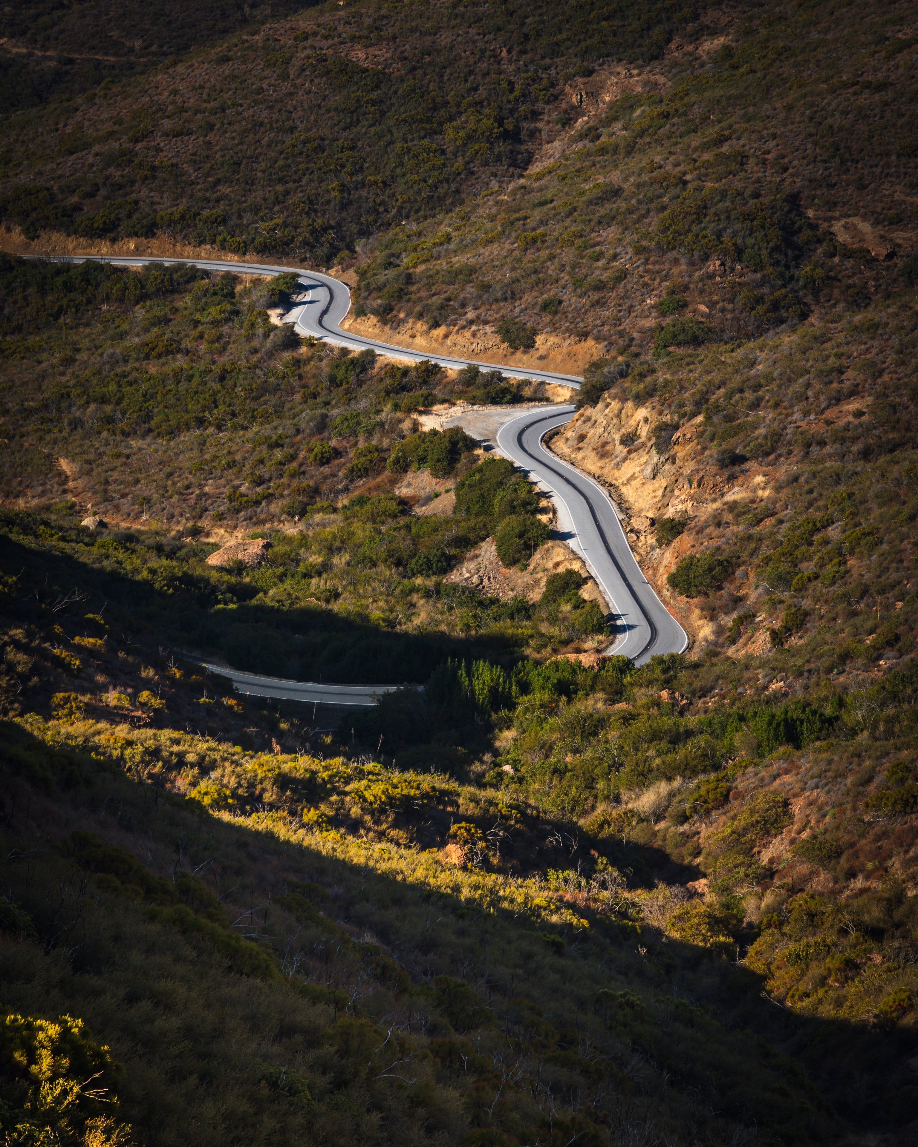 Winding road through chaparral hillside, Mishe Mokwa Trail